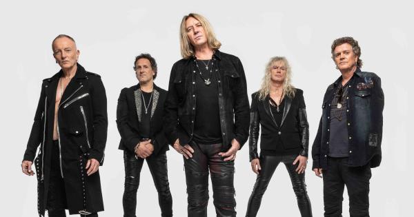 an image in QuizMyDay Def Leppard trivia quiz featuring a 2018 photo of the band members of Def Leppard