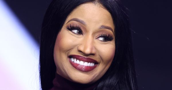 Image in QuizMyDay Nicki Minaj Albums Quiz: Test Your Music Expertise trivia quiz featuring Nicki Minaj speaking with attendees at the 2025 AmericaFest at the Phoenix Convention Center in Phoenix, Arizona.