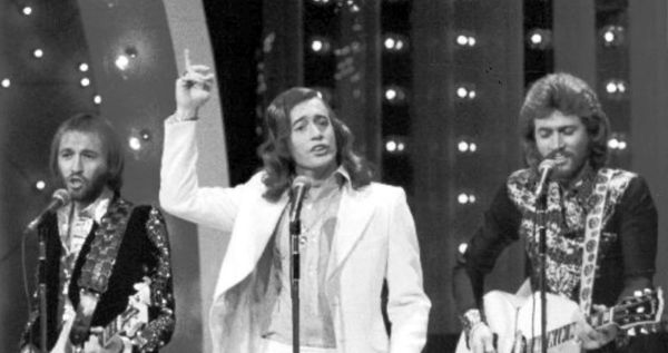 Image in QuizMyDay Bee Gees Ultimate Quiz: Disco Legends Trivia Now trivia quiz featuring a photo of the Bee Gees performing on the television program "The Midnight Special"