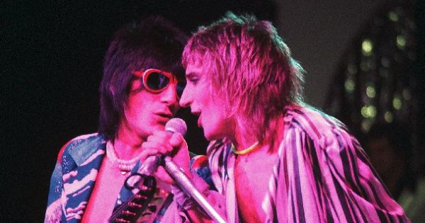 Image in QuizMyDay Face the Music: Faces Rock Trivia Challenge Quiz trivia quiz featuring Rod Stewart (right) and Ronnie Wood (left) of the band Faces, in concert 1975
