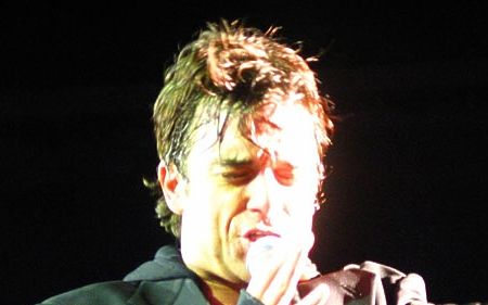 Robbie Williams singing in concert