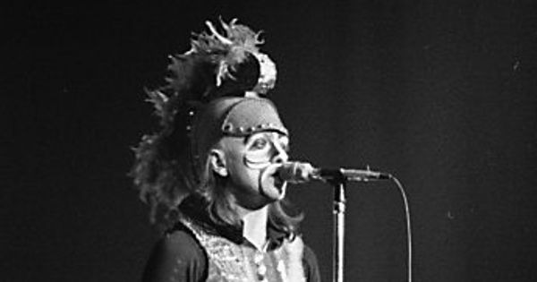 Image in QuizMyDay Genesis Early Albums Quiz: Test Your Music Memory trivia quiz featuring Peter Gabriel as "Britannia" performing <i>Dancing With The Moonlit Knight</i> with Genesis, Massey Hall, Toronto, Nov. 8th 1973