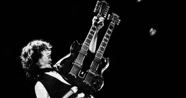 Image in QuizMyDay Led Zeppelin Song Quiz — 5 Questions | Quick Rock Trivia trivia quiz featuring Jimmy Page during the final solo of Stairway to Heaven