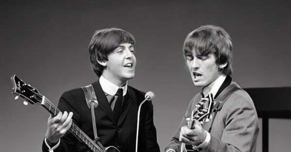Image in QuizMyDay Beatles Trivia Quiz: From Birthdays to Chart-Topping Hits trivia quiz featuring short-haired  Paul McCartney and George Harrison in a black and white picture