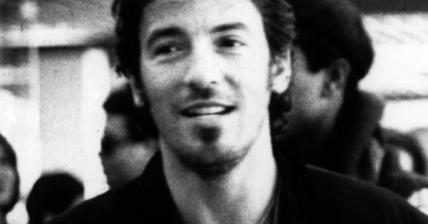 Image in QuizMyDay Born to Run: The Ultimate Bruce Springsteen Trivia Challenge trivia quiz featuring a black and white image of a young Bruce Springsteen