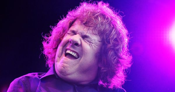 Image in QuizMyDay The Ultimate Gary Moore Quiz: Can You Score 5/5? trivia quiz featuring Gary Moore playing at the Beach of Pite-Havsbad, outside the city of Piteå in Sweden.