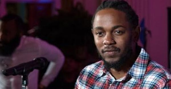 Image in QuizMyDay Kendrick Lamar 'DAMN.' Album Quiz: Test Your Music Facts trivia quiz featuring Cropped photograph of Kendrick Lamar at a 4th of July celebration with Barack Obama and Janelle Monáe at the White House in 2016