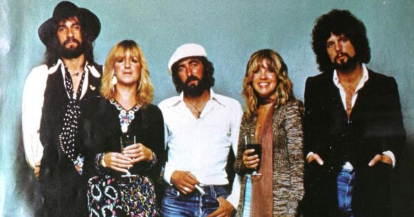 Group advertising photograph of Fleetwood Mac for their album <i>Rumours</i>. From left to right: Mick Fleetwood, Christine McVie, John McVie, Stevie Nicks and Lindsey Buckingham. The photograph was published on the 25 June 1977 issue of <i>Billboard</i> magazine, thus being an advertising pre-1978 photograph with no explicit copyright notice it is in public domain