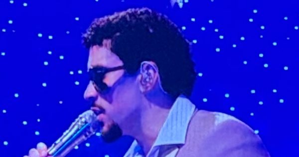 Image in QuizMyDay The Ultimate Bad Bunny Songs Quiz: Hop to the Beat trivia quiz featuring Bad Bunny performing Baile Inolvidable at the 'No me quiero ir de aquí' Residency - Puerto Rico