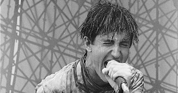 Image in QuizMyDay Reznor Recall: Trent Reznor Knowledge Quiz trivia quiz featuring <a href="https://en.wikipedia.org/wiki/en:Trent_Reznor" class="extiw" title="w:en:Trent Reznor">Trent Reznor</a> of <a href="https://en.wikipedia.org/wiki/en:Nine_Inch_Nails" class="extiw" title="w:en:Nine Inch Nails">Nine Inch Nails</a> during a live performance in the <a href="https://en.wikipedia.org/wiki/en:Lollapalooza" class="extiw" title="w:en:Lollapalooza">Lollapalooza</a> tour