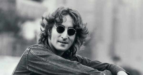 Image in QuizMyDay John Lennon Personal Life: Knowledge Quiz trivia quiz featuring Press photo of John Lennon dated to 1974. It was a part of a press kit themed "Listen to This __" to promote his album <i>Walls and Bridges</i>. Bottom right reads "Apple Records by Capitol Records". No copyright markings on the photo.