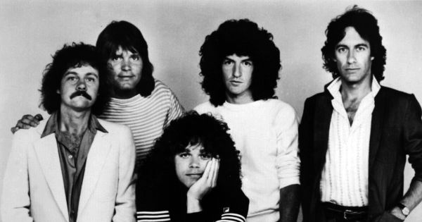Image in QuizMyDay REO Speedwagon Quiz: Test Your Rock Band Facts trivia quiz featuring American rock band REO Speedwagon in 1982. From left to right: Neal Doughty, Bruce Hall, Gary Richrath, Kevin Cronin and Alan Gratzer