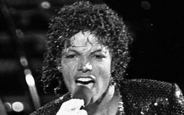 The Jacksons performing on stage at Arrowhead Stadium, Kansas City, during the Victory Tour