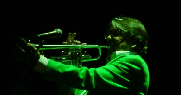 Image in QuizMyDay Ultimate Supertramp Albums Knowledge Challenge trivia quiz featuring Supertramp in concert at the Palacio de Deportes (Sports Palace), Madrid, Spain. Here is trumpeter Lee Thornburg.