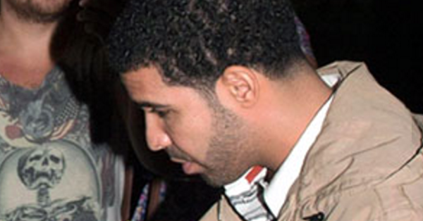 Image in QuizMyDay Drake 'Take Care' Album Quiz: Test Your Music Trivia Skills trivia quiz featuring Drake pictured leaving UK nightclub Tup Tup Palace in 2012