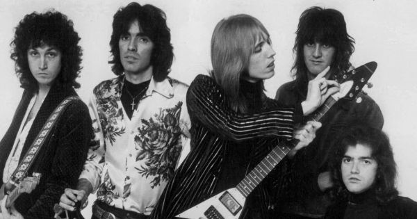 Image in QuizMyDat Tom Petty trivia quiz featuring a black and white photo of the musical group Tom Petty and the Heartbreakers.
