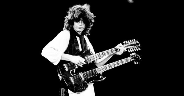 Image in QuizMyDay Led Zeppelin Trivia: 10-Question Quiz Challenge trivia quiz featuring Jimmy Page at the A.R.M.S. benefit at The Cow Palace, San Francisco, Ca., in 1983.