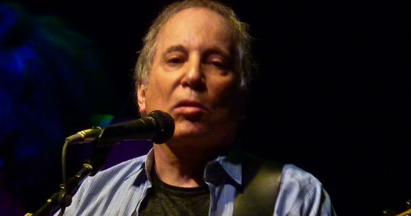 Image in QuizMyDay Paul Simon Quiz: Hits, Albums & Career Deep Dive trivia quiz featuring Paul Simon playing at the <a href="https://en.wikipedia.org/wiki/9:30_Club" class="extiw" title="en:9:30 Club">9:30 Club</a> in Washington, D.C.