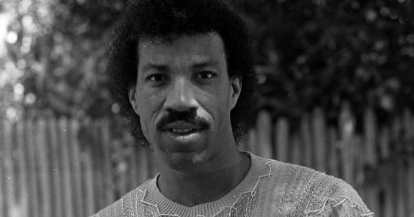 Image in QuizMyDay Lionel Richie Mastery Quiz: Hit Facts & History trivia quiz featuring 3/4 length portrait of singer Lionel Richie