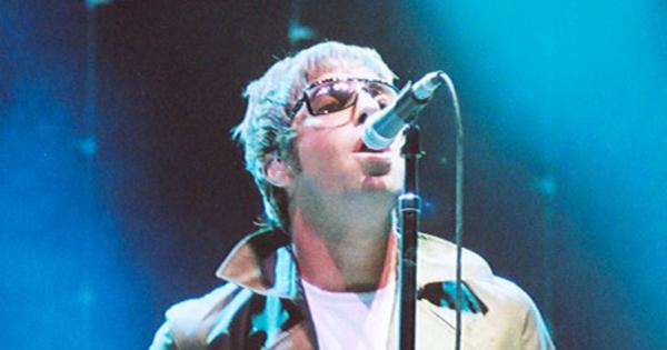 Image in QuizMyDay Test how well you know the legendary Britpop band that defined a generation trivia quiz featuring Liam Gallagher of Oasis performing at a concert in San Diego 2005
