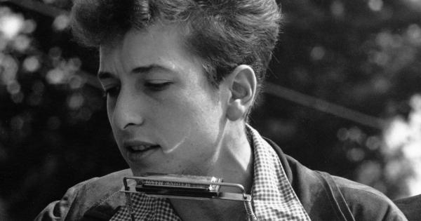 Image in QuizMyDay Bob Dylan trivia game featuring a close-up view of Bob Dylan at the Civil Rights March on Washington, D.C., August 28, 1963