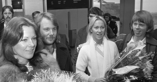 Image in QuizMyDay ABBA Eurovision Quiz: Ultimate Pop Trivia Test trivia quiz featuring the Swedish pop group Abba in the Netherlands; from left to right Benny, Frida, Anna and Björn in the spotlight at Schiphol