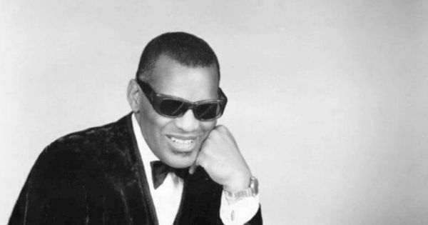 Image in QuizMyDay Hit the Road Jack: The Ultimate Ray Charles Quiz trivia quiz featuring Photo of Ray Charles in one of his classic poses at the piano.