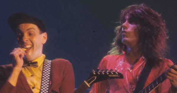 Image in QuizMyDay Cheap Trick Quiz: Challenge Your Fan Expertise trivia quiz featuring Rick Nielsen and Tom Petersson of Cheap Trick performing in in New Haven, CT in 1977