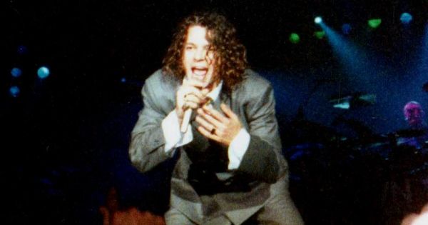 Michael Hutchence performing live on stage at a Madrid sports arena concert, November 1990.