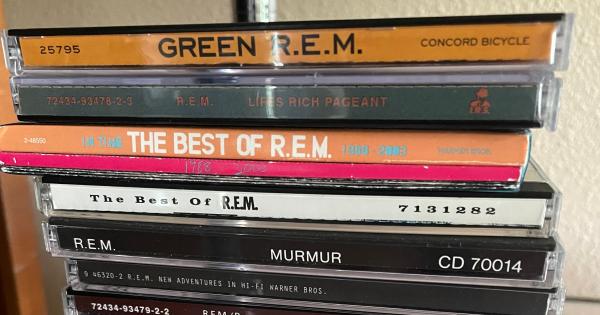 Image in QuizMyDay R.E.M. Discography Deep Dive Quiz: Test Knowledge trivia quiz featuring R.E.M. albums (from top to bottom): <i>Green</i>, <i>Lifes Rich Pageant</i>, <i>In Time: The Best of R.E.M.</i>, <i>The Best of R.E.M.</i>, <i>Murmur</i>, <i>New Adventures in Hi-Fi</i>, <i>Fables of the Reconstruction</i>/<i>Reconstruction of the Fables</i>, <i>R.E.M. in the Attic</i>, <i>Monster</i>, <i>Document</i>, <i>Automatic for the People</i>, and <i>Up</i>.