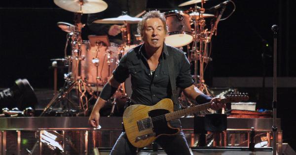 Image in QuizMyDay The Boss Quiz: How Well Do You Know Bruce Springsteen? trivia quiz featuring Bruce Springsteen and Max Weinberg in the background on drums in concert