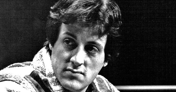 Image in QuizMyDay Rocky Movie Hits: Iconic Songs Quiz Challenge trivia quiz featuring Photo of Sylvester Stallone at the Ken Norton - Duane Bobick boxing match in 1977.