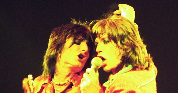 Image in QuizMyDay Rolling Stones Members Quiz: From Founding Legends to Rock Icons trivia quiz featuring Mick Jagger (right) and Ronnie Wood (left) of the Rolling Stones in concert in Chicago