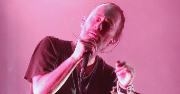 Image in QuizMyDay Radiohead Quiz: 5 Quick Questions trivia quiz featuring Thom Yorke singing on a pink background