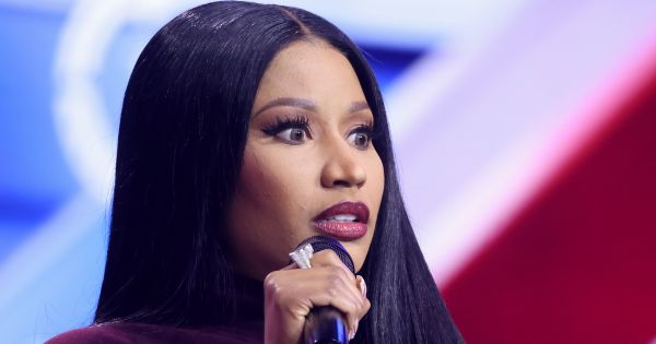 Image in QuizMyDay Nicki Minaj Collaborations Quiz: Test Your Music Memory trivia quiz featuring Nicki Minaj speaking with attendees at the 2025 AmericaFest at the Phoenix Convention Center in Phoenix, Arizona.