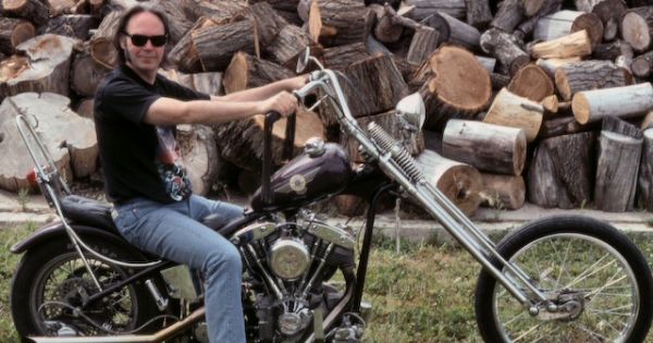 Image in QuizMyDay Ultimate Harvest Deep Dive: Neil Young Album Quiz trivia quiz featuring Neil Young sitting on a Harley chopper in Newell, South Dakota, near Sturgis, circa 1992.