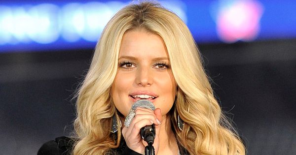 Image in QuizMyDay Take the Jessica Simpson Fan Trivia Quiz trivia quiz featuring Jessica Simpson singing "God Bless America" to military families at the "Joining Forces with the Rockies: Celebrating Military Families" at Coors Field in Denver, on April 13, 2011.