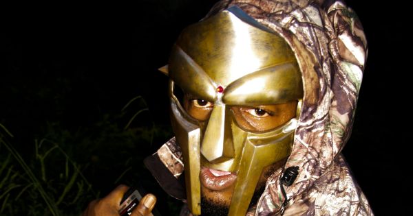 Image in QuizMyDay Masked Beats and Metal Faces: The MF DOOM Ultimate Quiz trivia quiz featuring Promotional photograph of rapper and producer <a href="https://en.wikipedia.org/wiki/MF_DOOM" class="extiw" title="w:MF DOOM">MF DOOM</a> for his upcoming concert at <a href="https://en.wikipedia.org/wiki/The_Arches_(Glasgow)" class="extiw" title="w:The Arches (Glasgow)">The Arches</a> in <a href="https://en.wikipedia.org/wiki/Glasgow" class="extiw" title="w:Glasgow">Glasgow</a>, <a href="https://en.wikipedia.org/wiki/Scotland" class="extiw" title="w:Scotland">Scotland</a>.