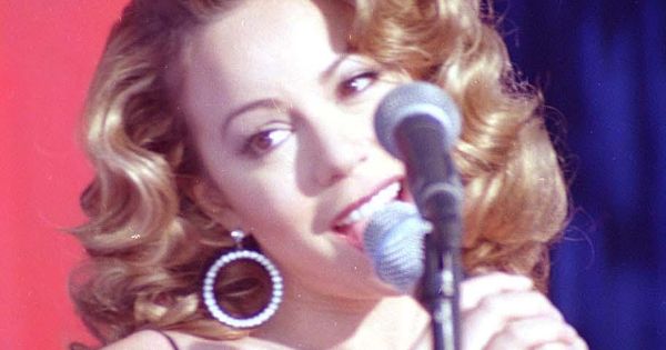 Image in QuizMyDay Ultimate Mariah Carey Quiz: Match Songs to Albums trivia quiz featuring Mariah Carey at Edwards Air Force Base in Dec. 1998. Carey takes time out of her video shoot to sing for the crowd. Her video "I Still Believe" was taped on Dec. 11 and 12, 1998, at Edwards Air Force Base.