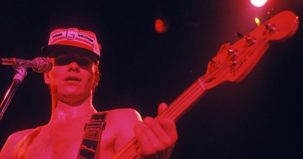 Image in QuizMyDay The Police Music Trivia Quiz: Test Your Knowledge of the Iconic Rock Trio trivia quiz featuring Sting at the Police concert at the Agora Ballroom, Atlanta, Georgia in 1979. Late in the concert a fan gave him a Georgia Bulldogs hat. Scanned Ektachrome slide.