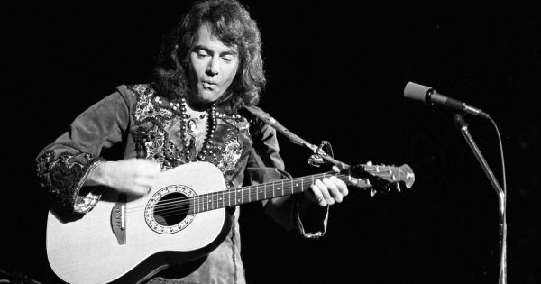 Image in QuizMyDay Neil Diamond Trivia Challenge: Test Your Knowledge trivia quiz featuring Neil Diamond on stage at the Greek Theater in Los Angeles