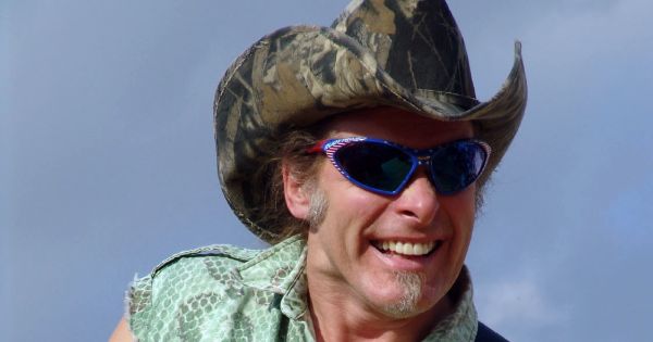 Image in QuizMyDay Ted Nugent Rock Music Quiz: Test Your Classic Rock Trivia Skills trivia quiz featuring Ted Nugent in concert; 040601-N-8861F-008 Naval Support Activity, Naples, Italy (Jun. 1, 2004) - The "Motor City Madman," Ted Nugent, wails away on his guitar during a recent concert for Sailors and their families at the United Service Organization (USO) sponsored concert held at Naval Support Activity, Naples, support site in Gricignano. Nugent was joined by country music star Toby Keith, who also performed some recently released songs. Nugent is also a spokesman for National Field Archers Association (NFAA), Mothers Against Drunk Driving (MADD), Big Brothers &amp; Big Sisters, and the Drug Abuse Resistance Education (D.A.R.E.) law enforcement program. Both singers will also be traveling to Germany, Kosovo and the Persian Gulf during the tour. U.S. Navy photo by Photographer's Mate 2nd Class Lenny Francioni