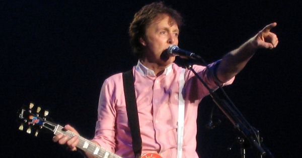 Image in QuizMyDay Paul McCartney Collabs Quiz: Test Your Music Expertise trivia quiz featuring <a href="https://nl.wikipedia.org/wiki/Paul_McCartney" class="extiw" title="nl:Paul McCartney">Paul McCartney</a> in Arnhem, playing his customised Les Paul Guitar painted by Rosie Brooks at the <a href="https://nl.wikipedia.org/wiki/GelreDome" class="extiw" title="nl:GelreDome">GelreDome</a>.