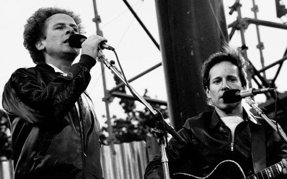 Singer-Songwriter duo Simon &amp; Garfunkel performing outside at a concert in Dublin