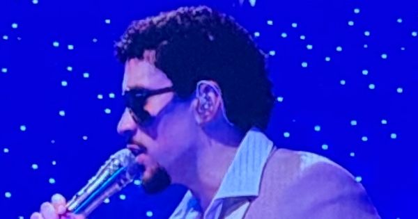 Image in QuizMyDay Bad Bunny Quiz: Testing Your Knowledge of His Biggest Live Milestones trivia quiz featuring Bad Bunny performing Baile Inolvidable at the 'No me quiero ir de aquí' Residency - Puerto Rico