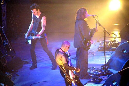 Simon Gallop, Porl Thompson e Robert Smith durànt un cuncèrt a 'l Allstate Arena