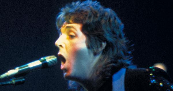 Image in QuizMyDay Ultimate Paul McCartney Solo Career Quiz — Test Your Knowledge on Albums, Hits & Trivia trivia quiz featuring <a href="https://en.wikipedia.org/wiki/Paul_McCartney" class="extiw" title="w:Paul McCartney">Paul McCartney</a> (right) and <a href="https://en.wikipedia.org/wiki/Jimmy_McCulloch" class="extiw" title="w:Jimmy McCulloch">Jimmy McCulloch</a> during a <a href="https://en.wikipedia.org/wiki/Wings_(band)" class="extiw" title="w:Wings (band)">Wings</a> concert.