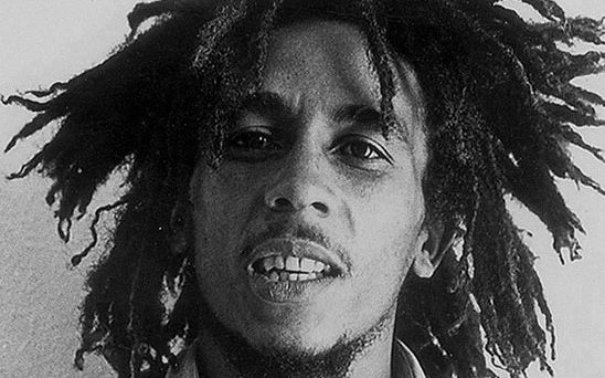 Bob Marley in a press photo dated to 1976. Photo was published by the US branch of Island Records. Newspaper clipping on back can be traced to the <a rel="nofollow" class="external text" href="https://www-newspapers-com.wikipedialibrary.idm.oclc.org/image/98221084/">Feburary 08 1976 issue of the Detroit Free Press</a>. No copyright markings on the photo