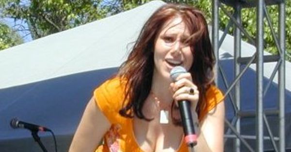 Image in QuizMyDay I Think We're Alone Now: The Ultimate Tiffany Quiz trivia quiz featuring Tiffany, performing at Gulfstream Park in Florida, 2003.  Taken by Daniel R. Tobias, who uploaded it here.