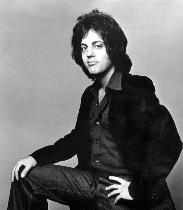 A Black and White picture of Billy Joel. This is the header picture for the Soft Rock QuizMyDay category